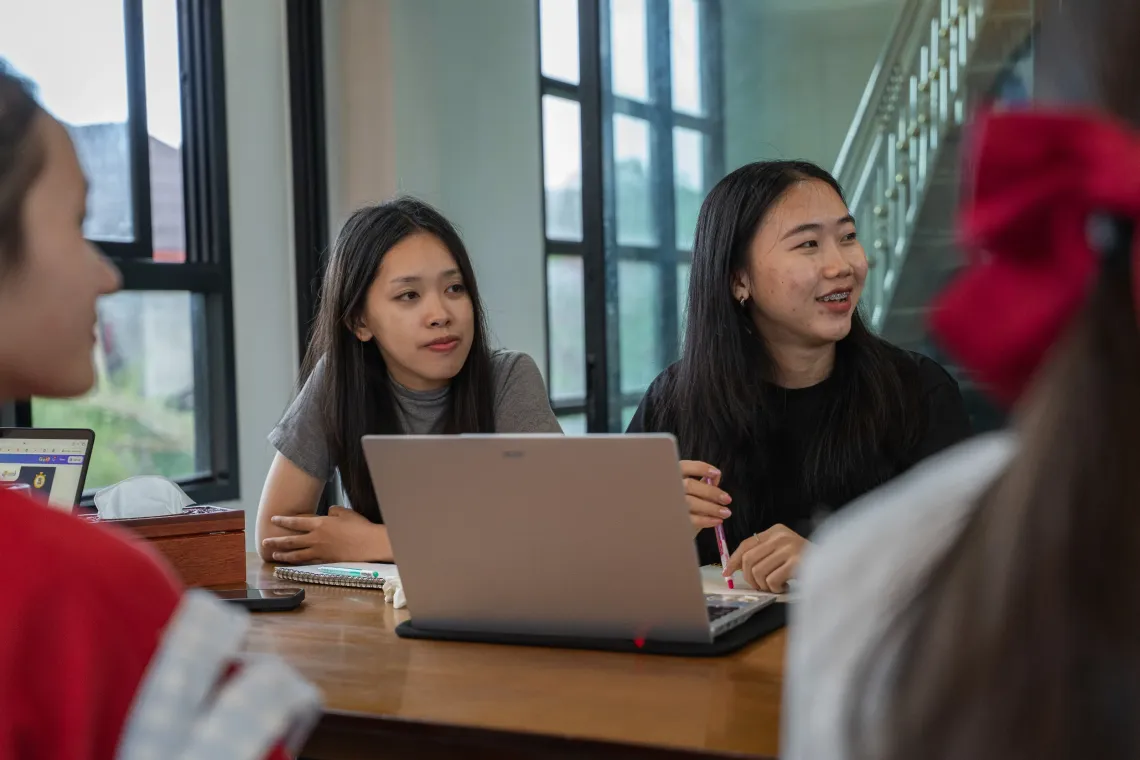 Sandy (left) and Chanphone (right) working together in the UNICEF Lao PDR office and in the field.