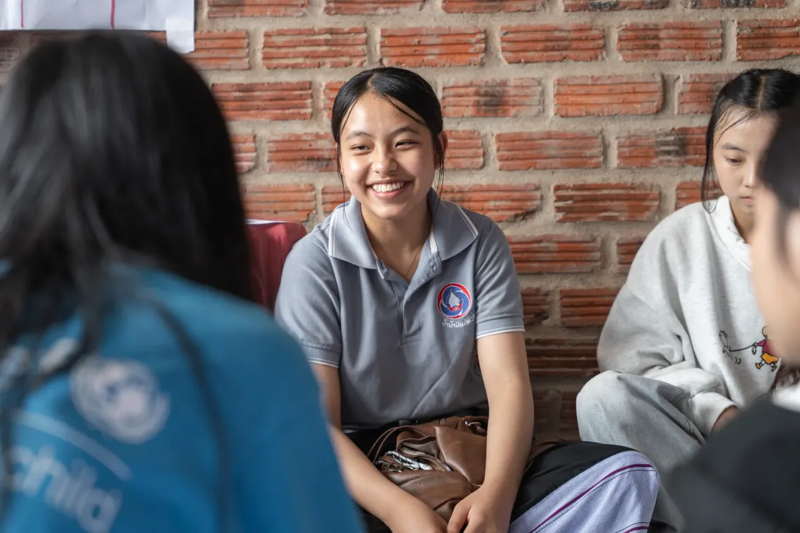 A young person smiling to the training