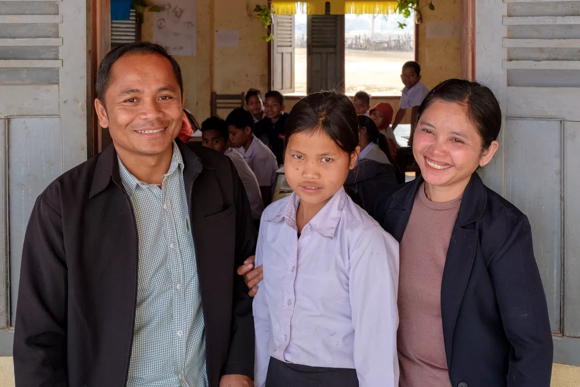 Mr. Sisamay Yankhampoun the school principal and Ms. Hsonejai Xayasone with Nam age 10. She is one of the student leaders of HAPiS. 