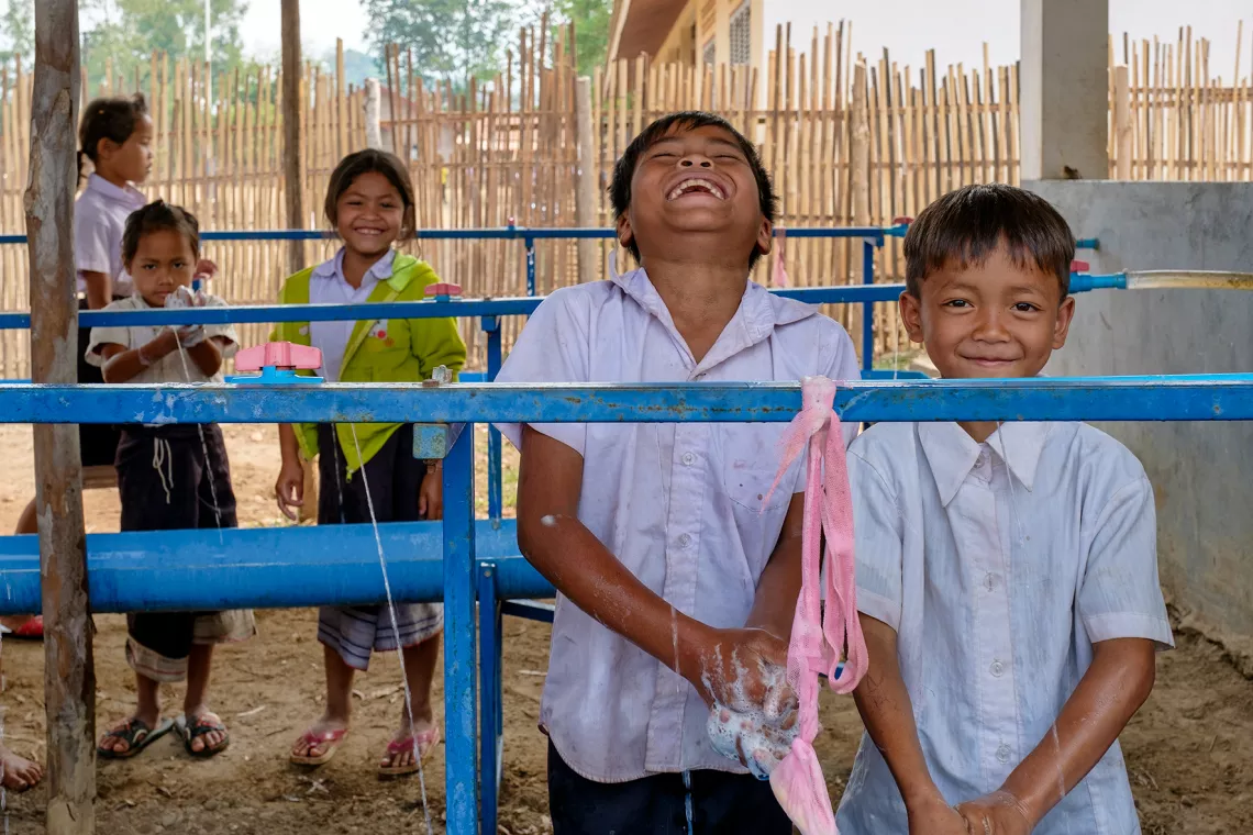 Children washing their hands as part of the daily Hygiene Actions Led by Pupils in Schools HAPiS programme at Doub Primary in Saravane. 