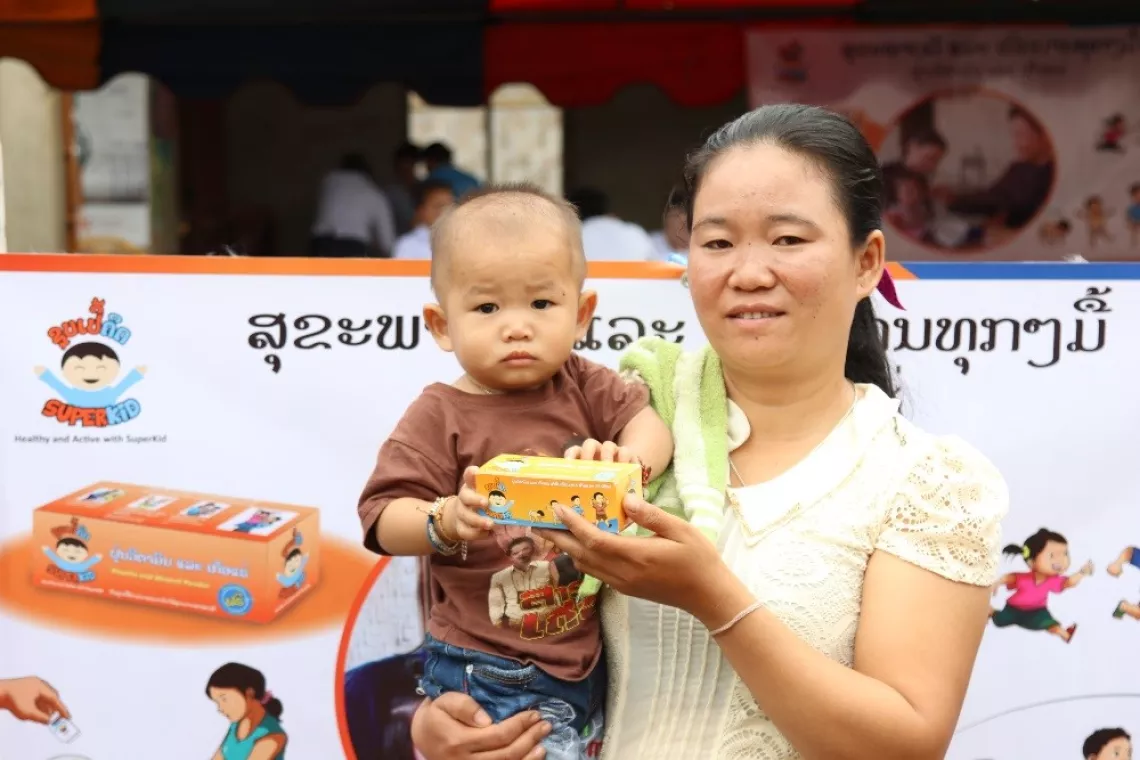 A mother and her son at a UNICEF-supported nutrition event