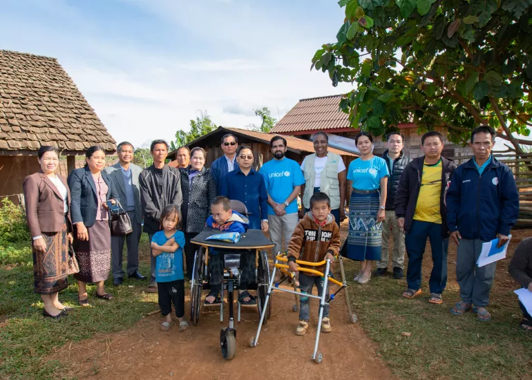 Representatives from the Lao Government and UNICEF with beneficiaries in Xiengkhouang. 