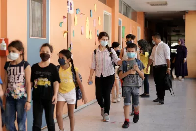 Pupils walk to class at Omar Hamad Public School