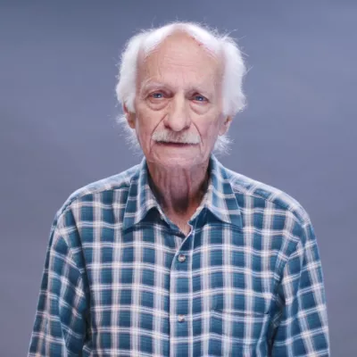 An elderly speaking about his experience with covid