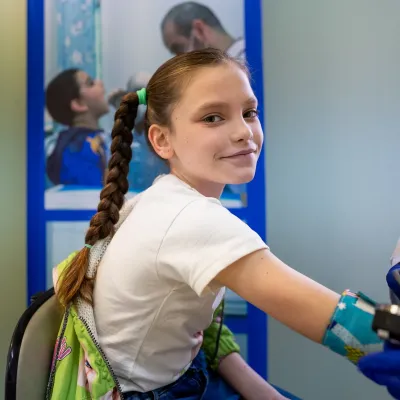 Sabine, 10 years old, getting check at school as part of the School Health Screening Programme 