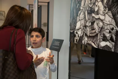 One of the children explaining his art work