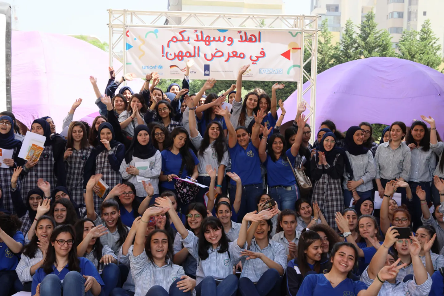 Young people smile for the camera at the Sin El Fil Careers Day