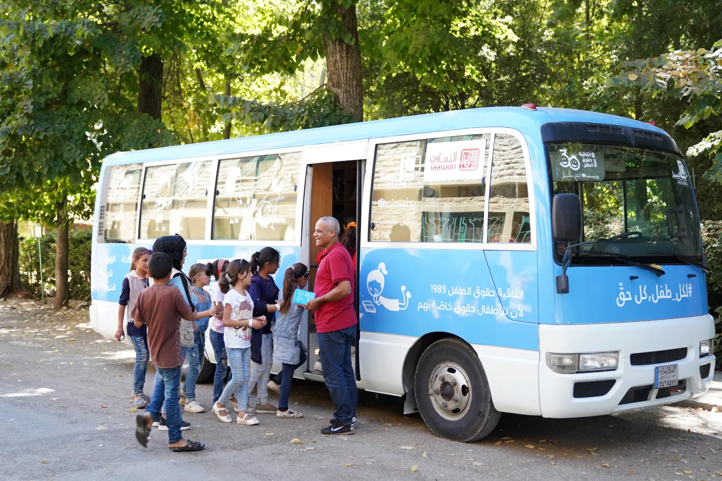 Children visiting the bus library and learning about their rights.