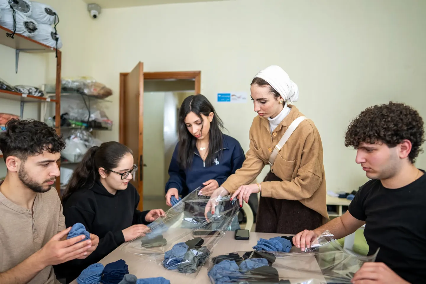 Youth participating in UNICEF&rsquo;s Learning to Earning programme, Stitching clothing items