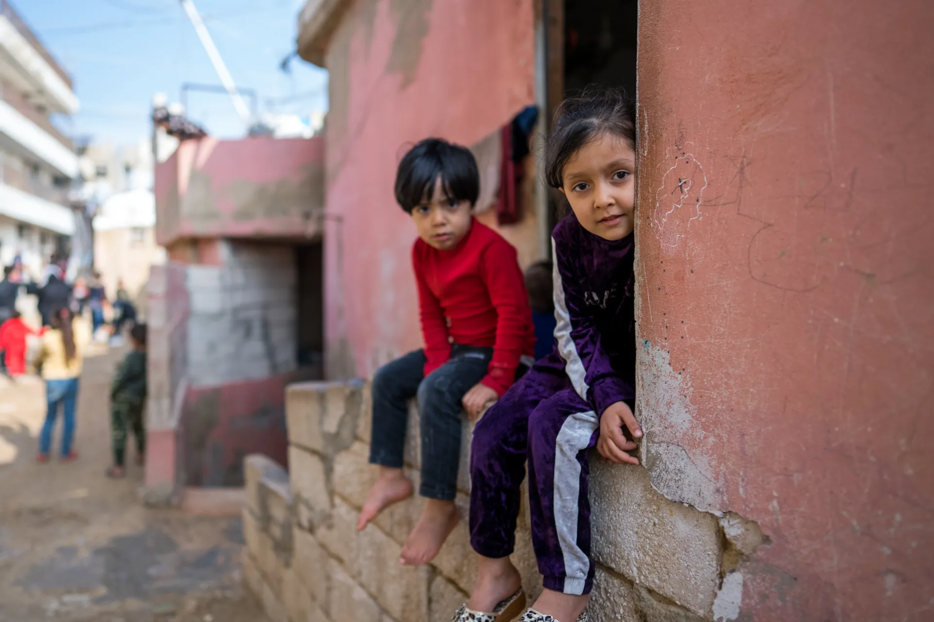 Two children looking at the camera 