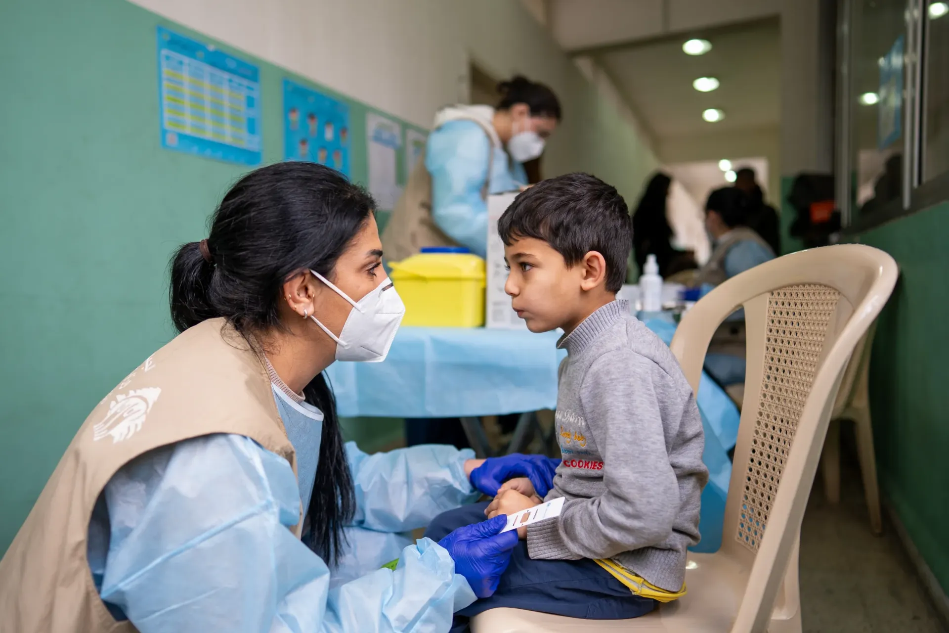 Ali, 5 years old taking Polio and DPT vaccines. 