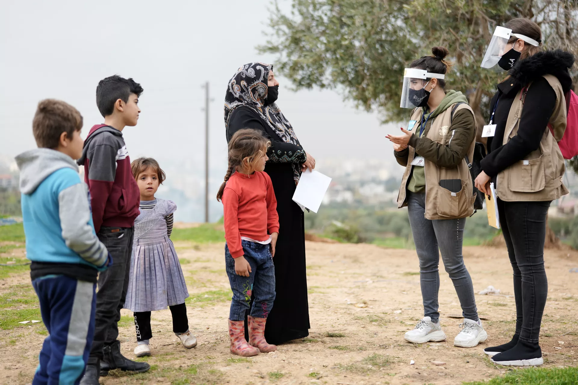 Outreach workers informing women and children on how to reach life-saving vaccination programmes.