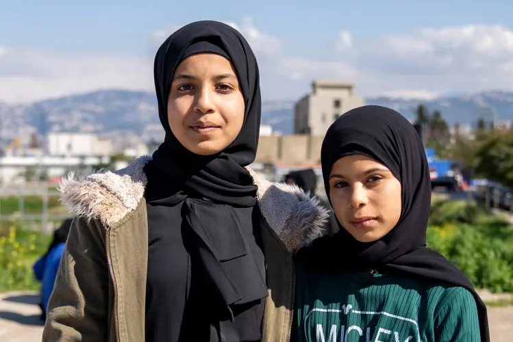 Farah 11 years old and Nada 10 years old standing next to each other
