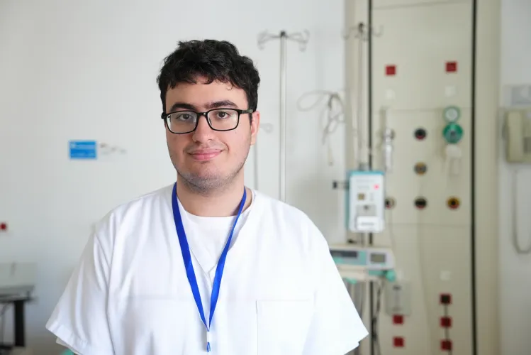 Miguel standing in a hospital room