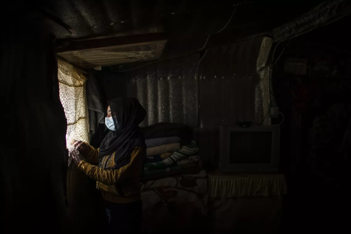 Rahaf, 15 years old at her family tent 