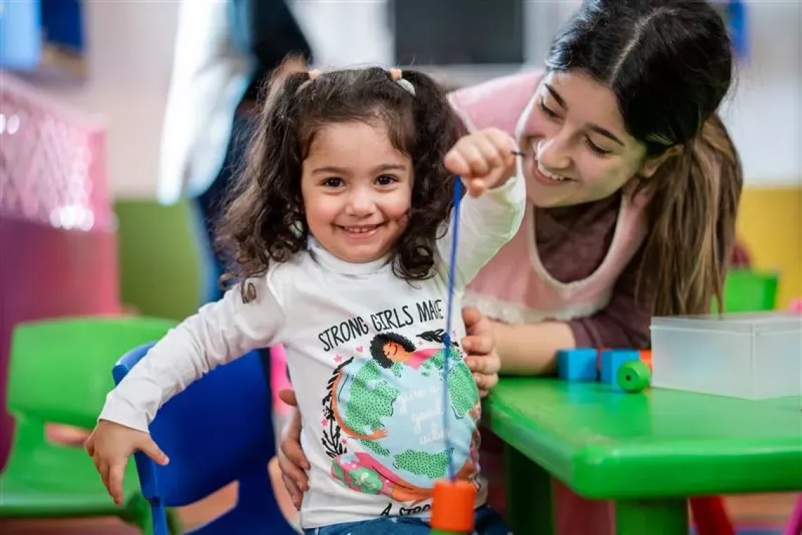 A kid playing at a childcare 