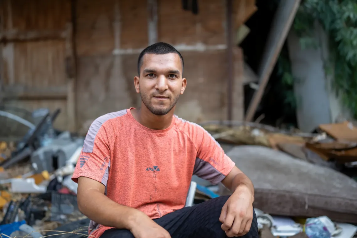 Mahmoud 20 years old sitting outside his home