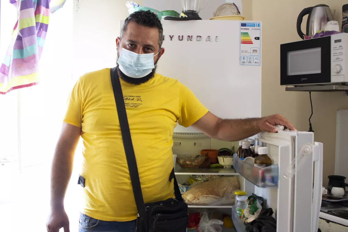 Markez, father of three young children at his home 