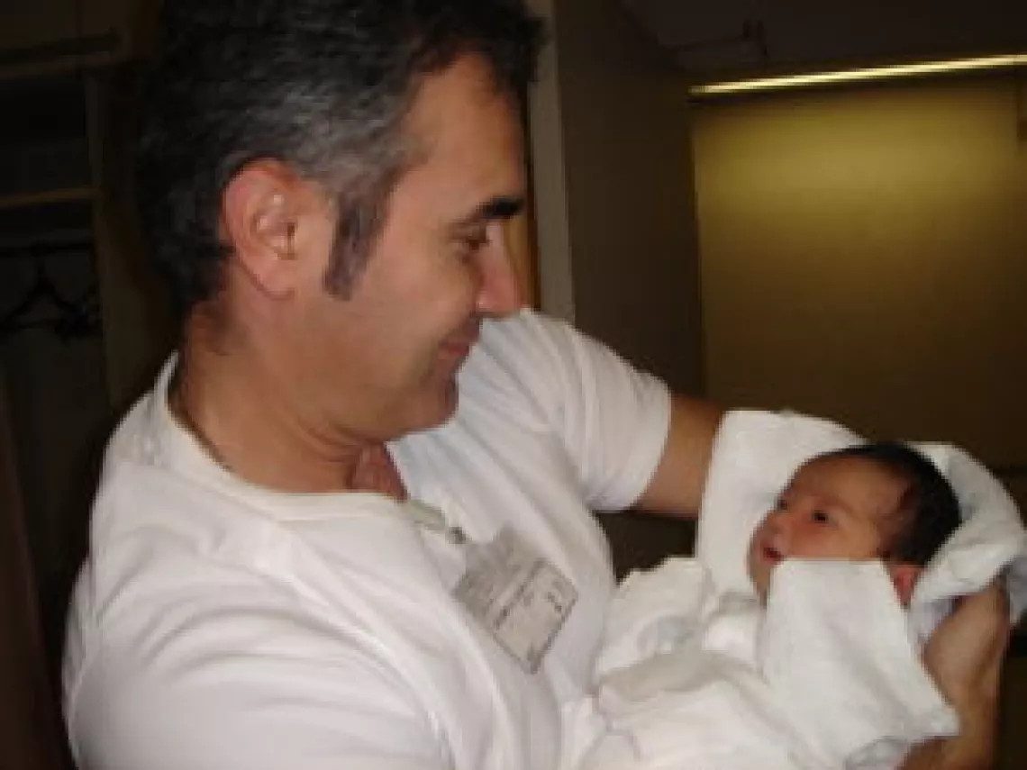 Yukie Mukuo husband with her newborn daughter, Pari. His support was one of the critical factors that made my breastfeeding possible.