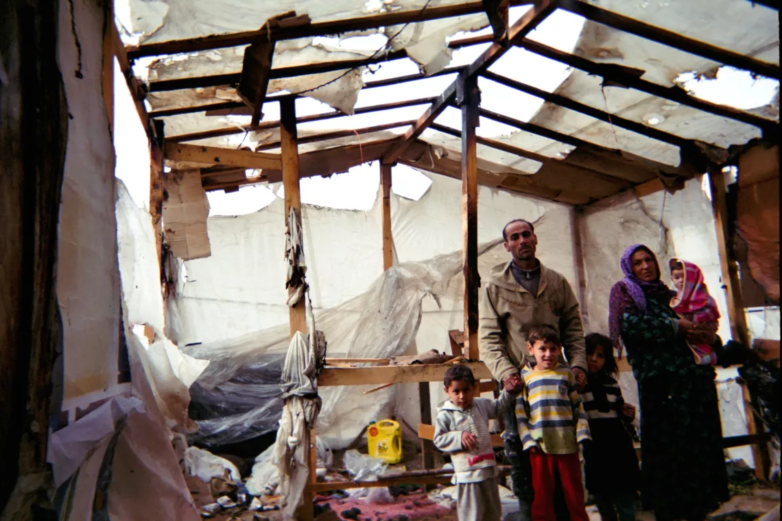 Family inside their tent after the fire.