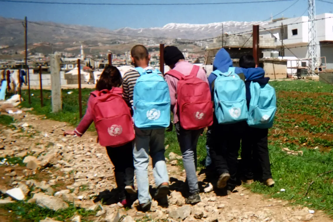 Five students wearing UNICEF bags 