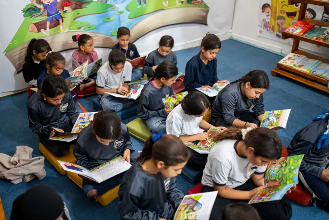 Children reading in a classroom
