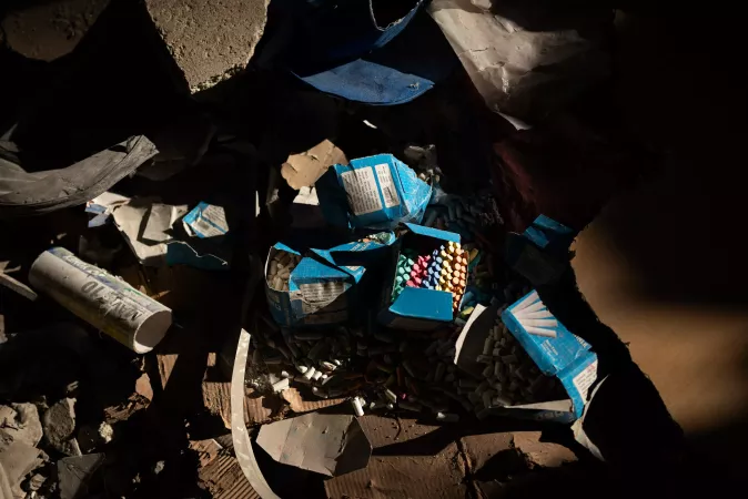 School chalks pile up on the floor inside a damaged school