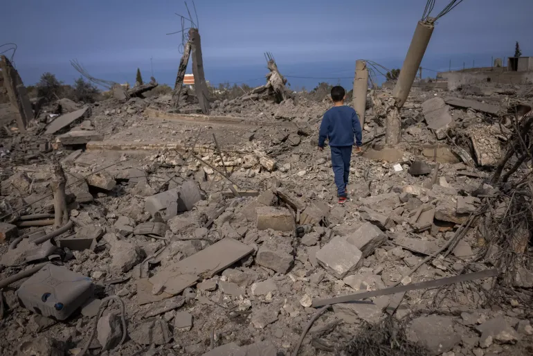 On February 22, 2024, friends of Hassan Al Durr, a 5-year-old girl killed in an airstrike, visit the aftermath of the deadly airstrike that claimed her life. Majdal Zoun, Southern Lebanon.