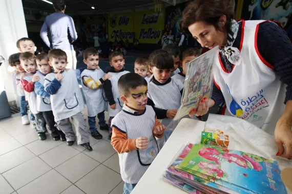 Children in line waiting to get their presents 
