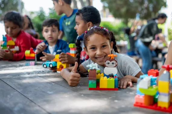 Hadil, 9 years old playing with Legos