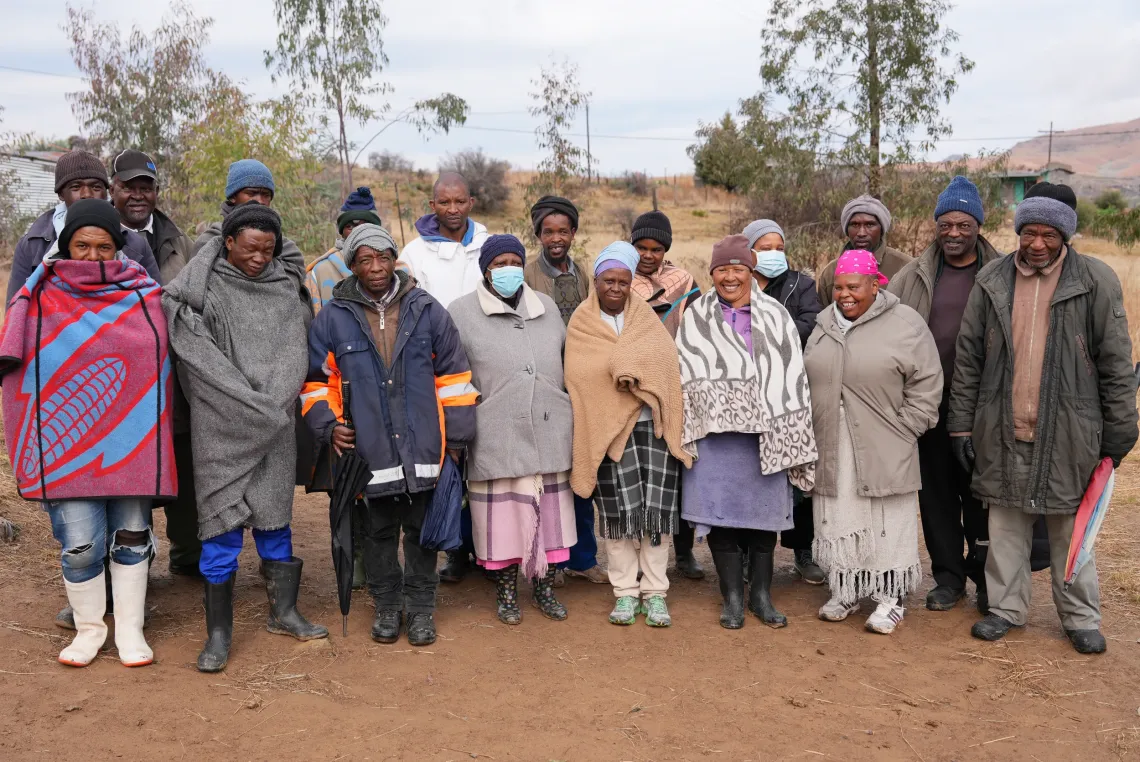 Group photo outdoors of members of the community water committee