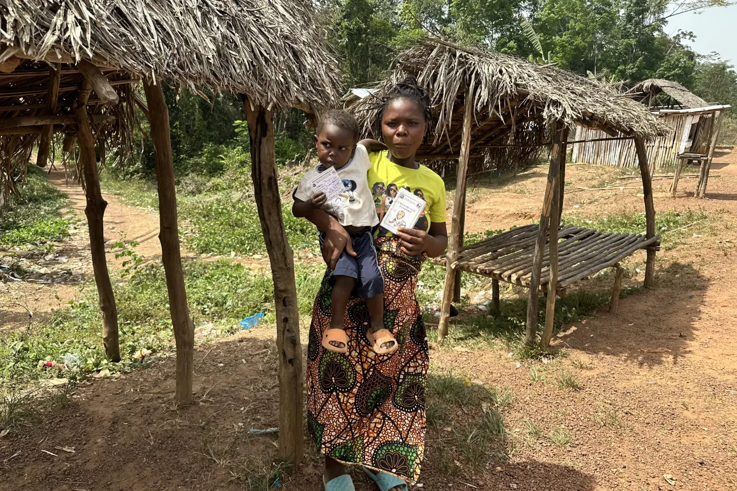 Mrs. Marie and her son Selvester celebrate full Measles vaccination