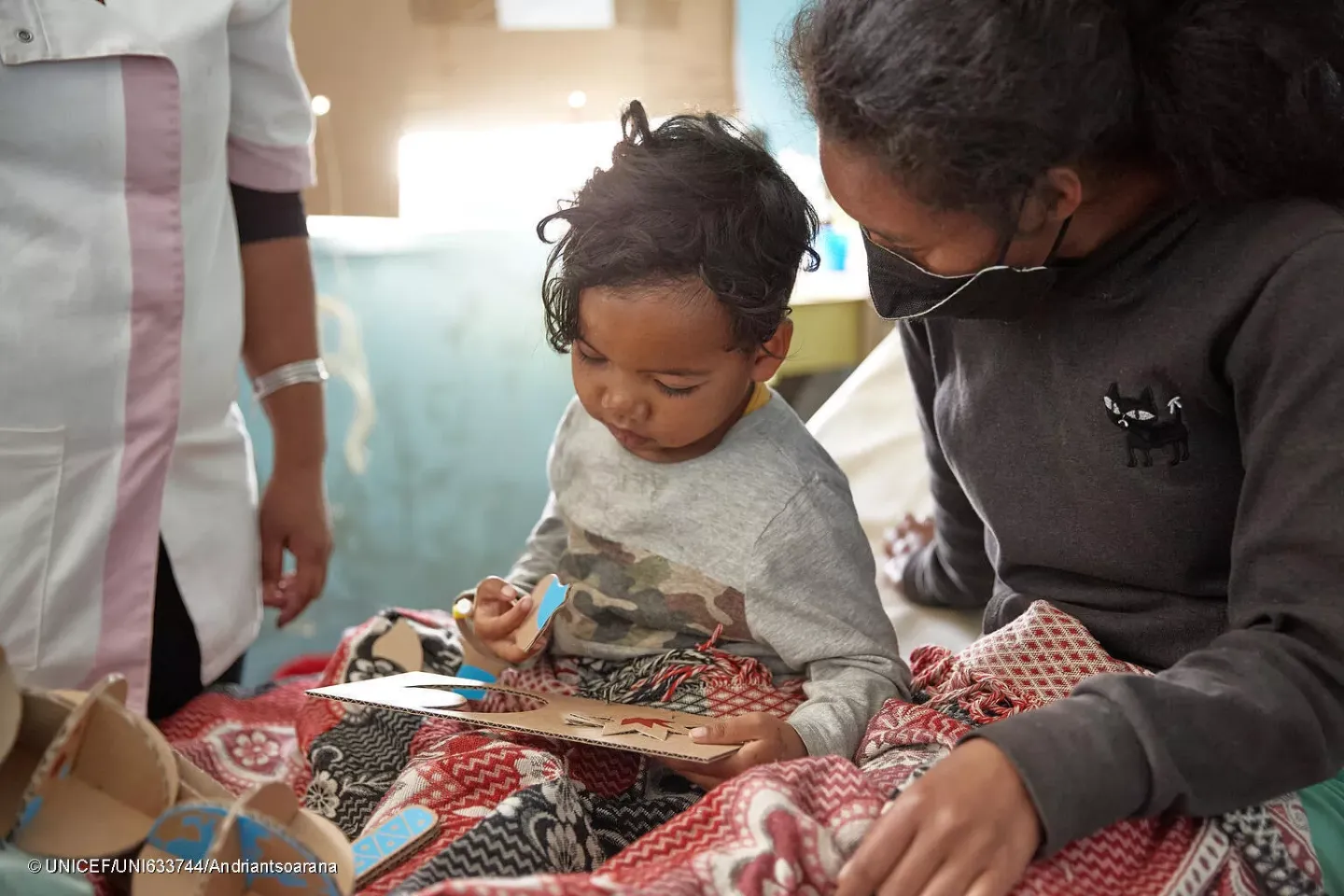 University Hospital Center Befelantanana,Antananarivo District, Analamanga Region, Madagascar.Fifaliana 5 years old testing the cognitive toy, the puzzle under the watchful eye of her nurse, her doctor who is also the one who took the training courses for the toys.