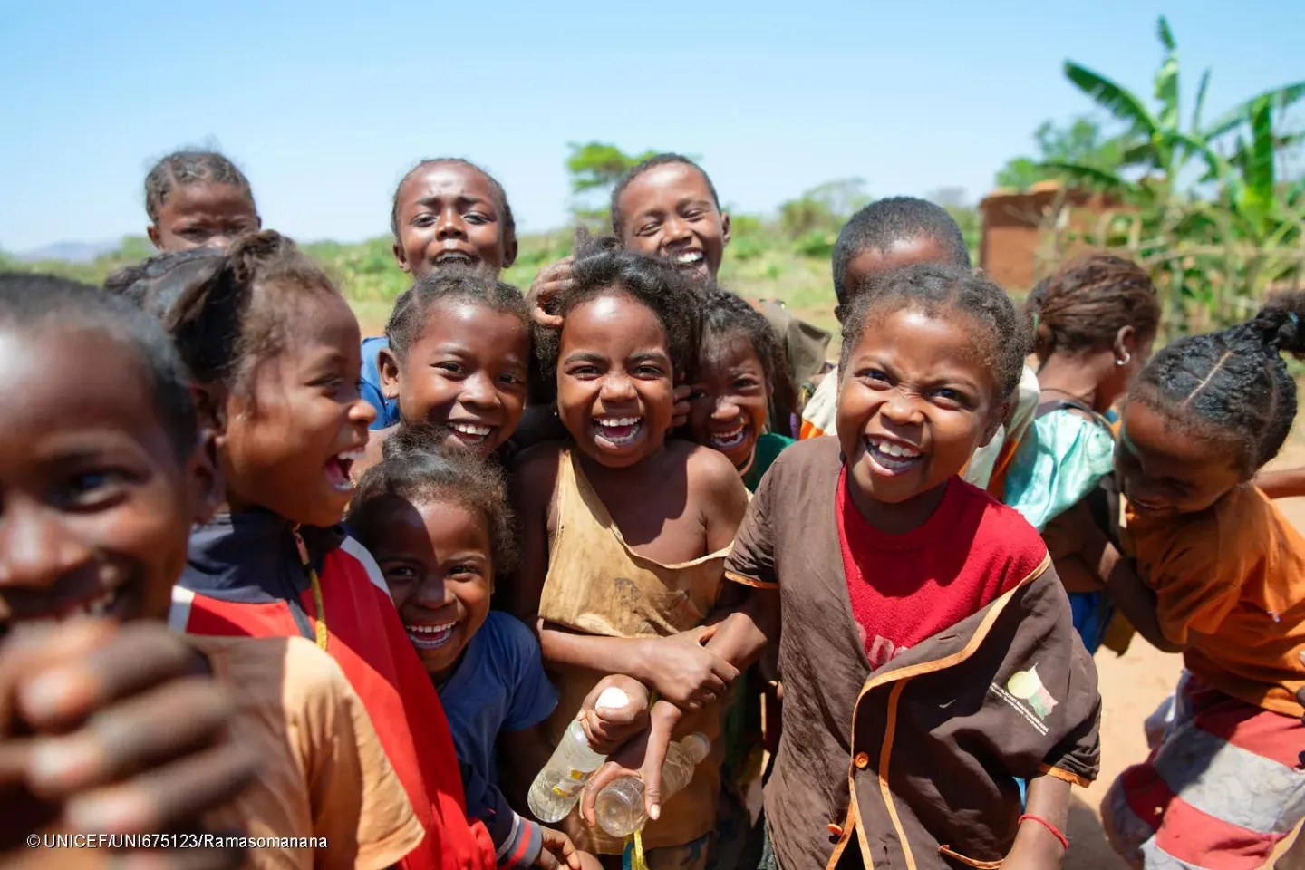 Ankilimilopaka Primary Public School, Commune of Antanimora Sud, Ambovombe District, Androy Region, Madagascar : group photo of smiling schoolkids taken in the schoolyard. 