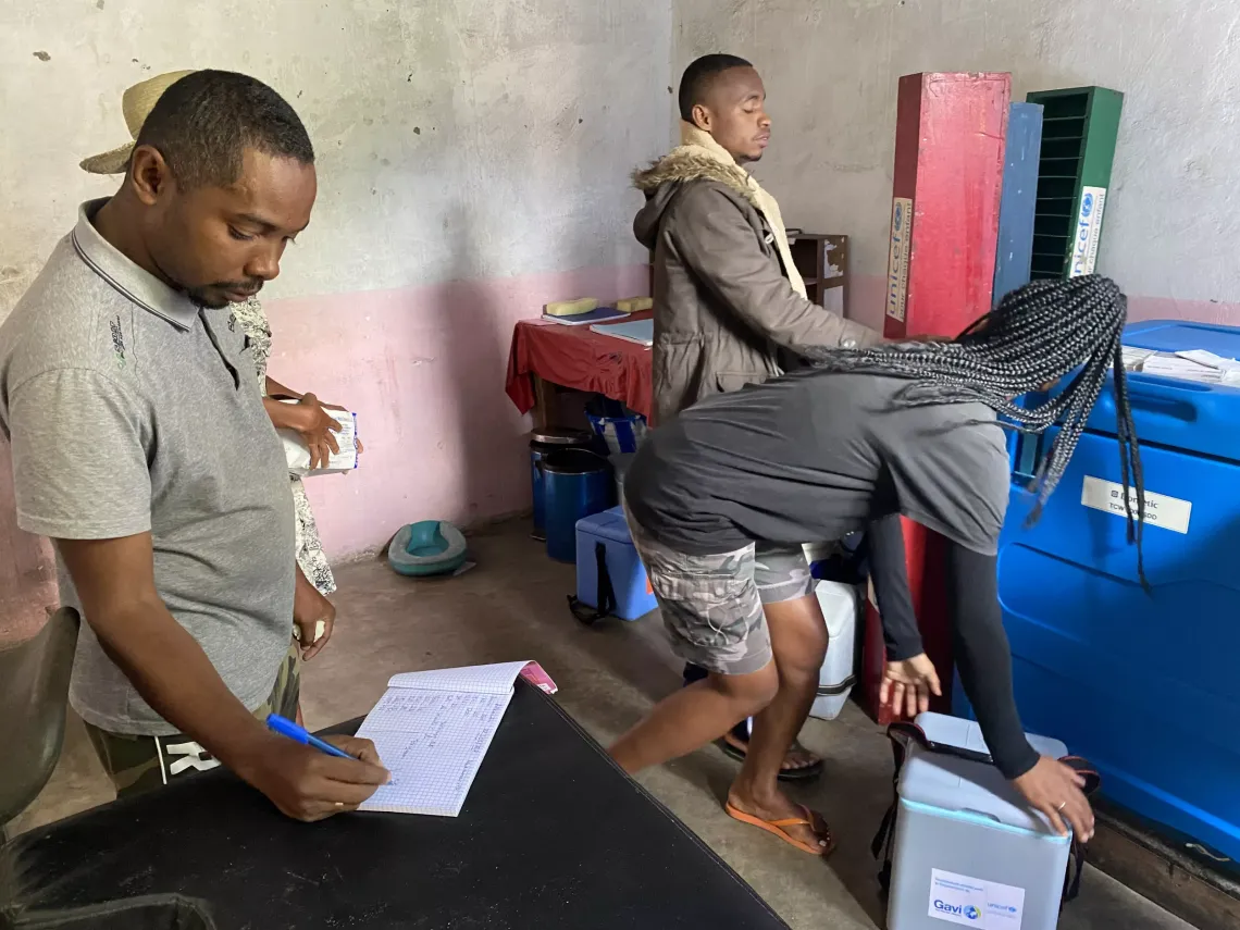 The team collects the vaccines and necessary materials from the town&rsquo;s health center ,