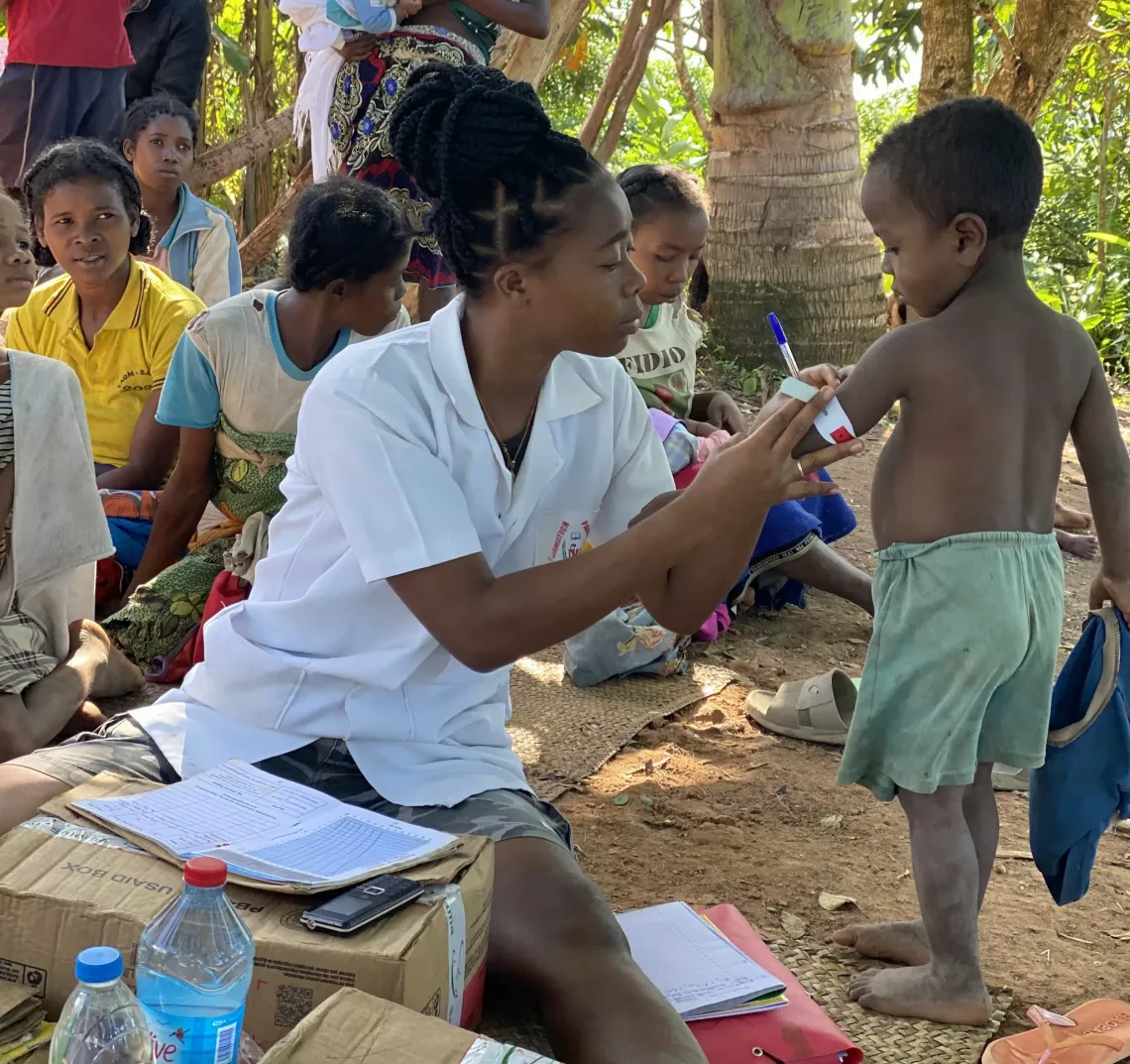 Alexia is measuring a child's mid-upper arm circumference