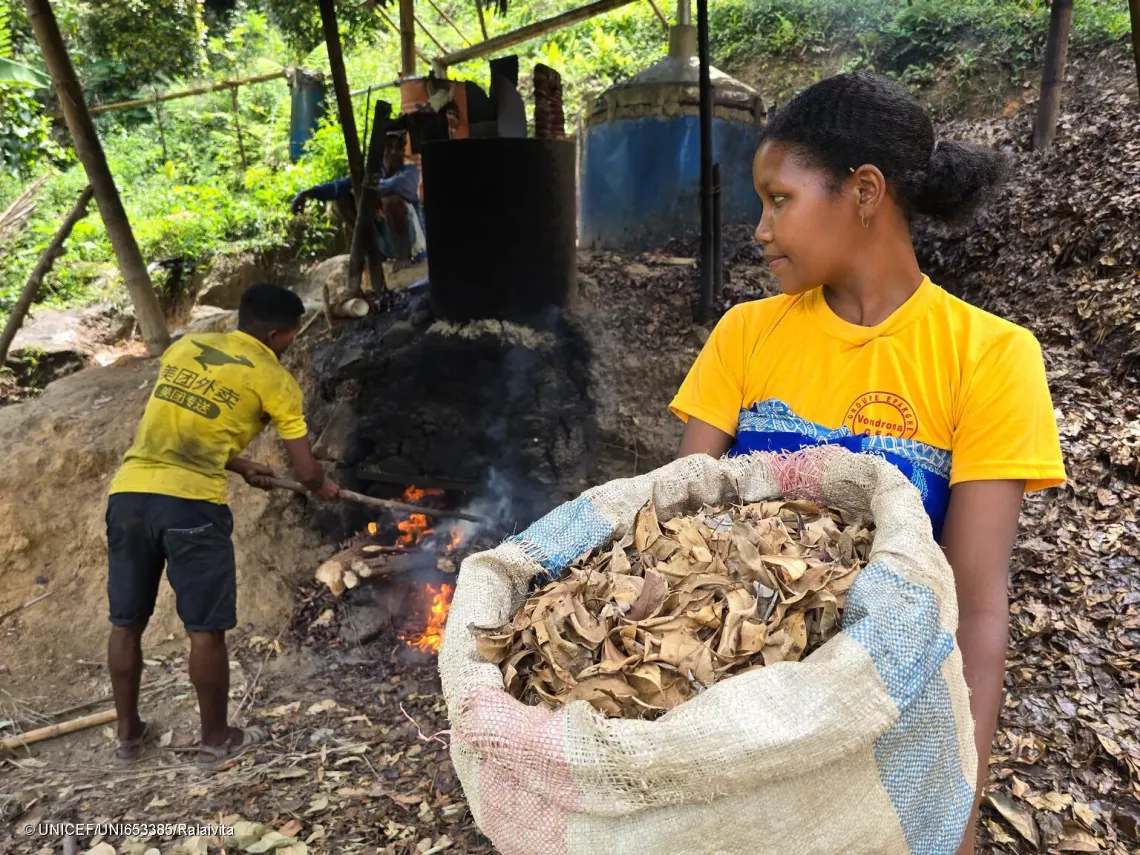 Claudia in the distillation unit where she will transform clove leaves into essential oil to sell.