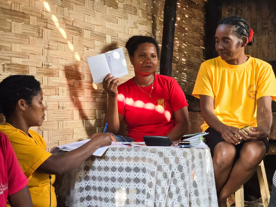 Ambonaivo village, Vavatenina District, Analanjirofo Region, Madagascar: The treasurer transparently handling the accounts during the community savings group meeting. Claudia, an ambitious young woman from Ambodivoanio, saw her life and that of her family transformed after joining a community savings group supported by UNICEF and its partners.