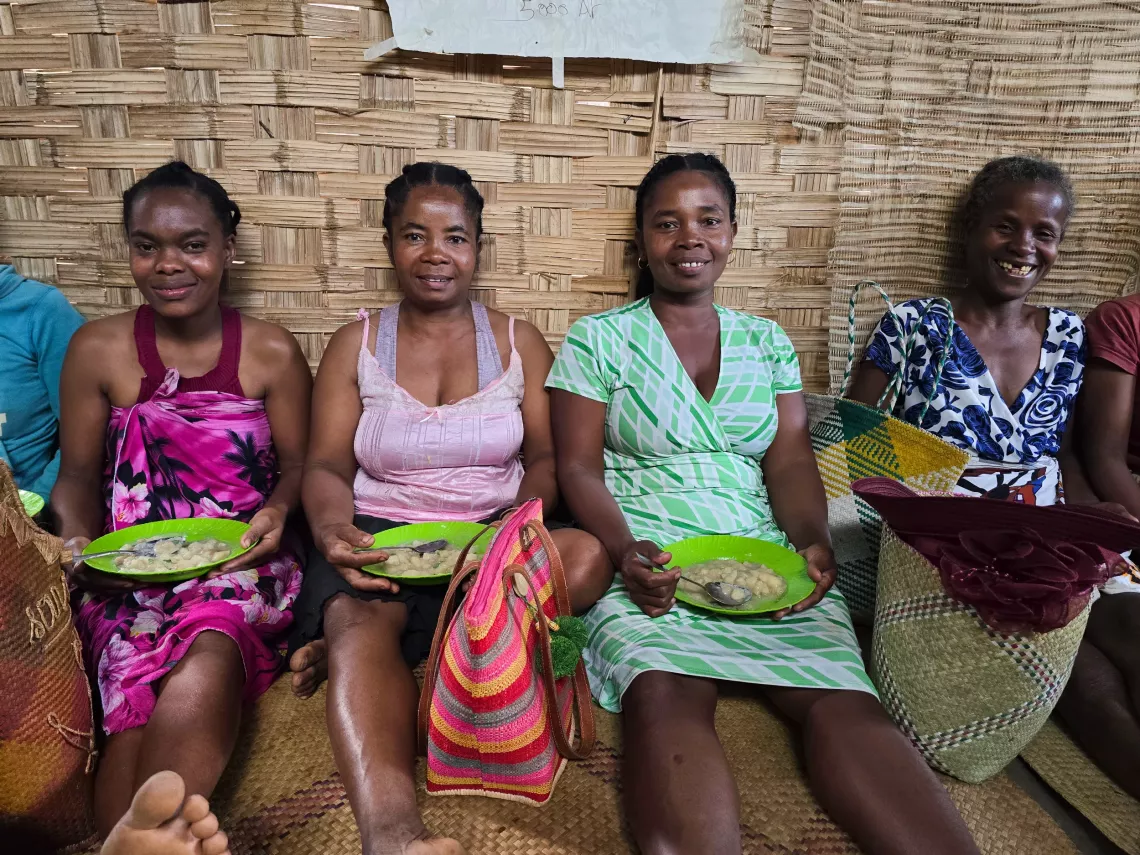 Ambonaivo village, Vavatenina District, Analanjirofo Region, Madagascar: Members enjoying snacks after the community savings group meeting.