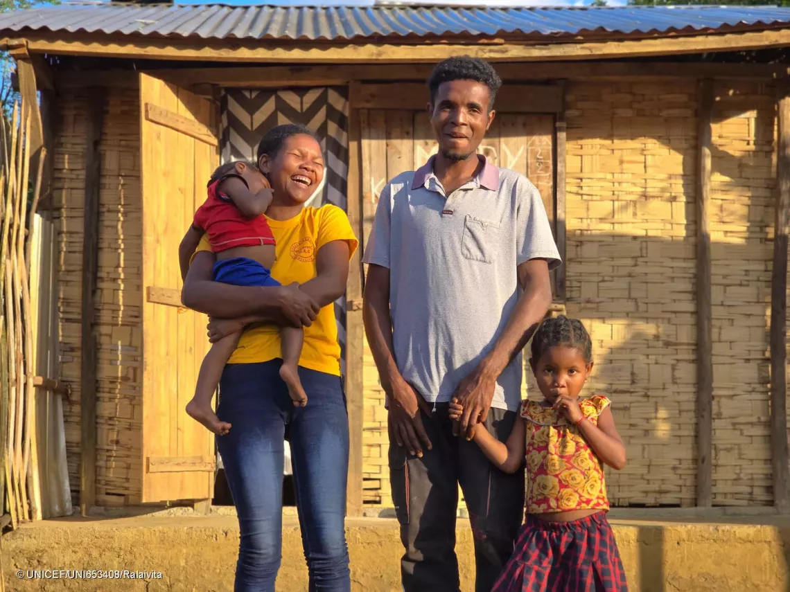 Portrait photo of Claudia and her family.
