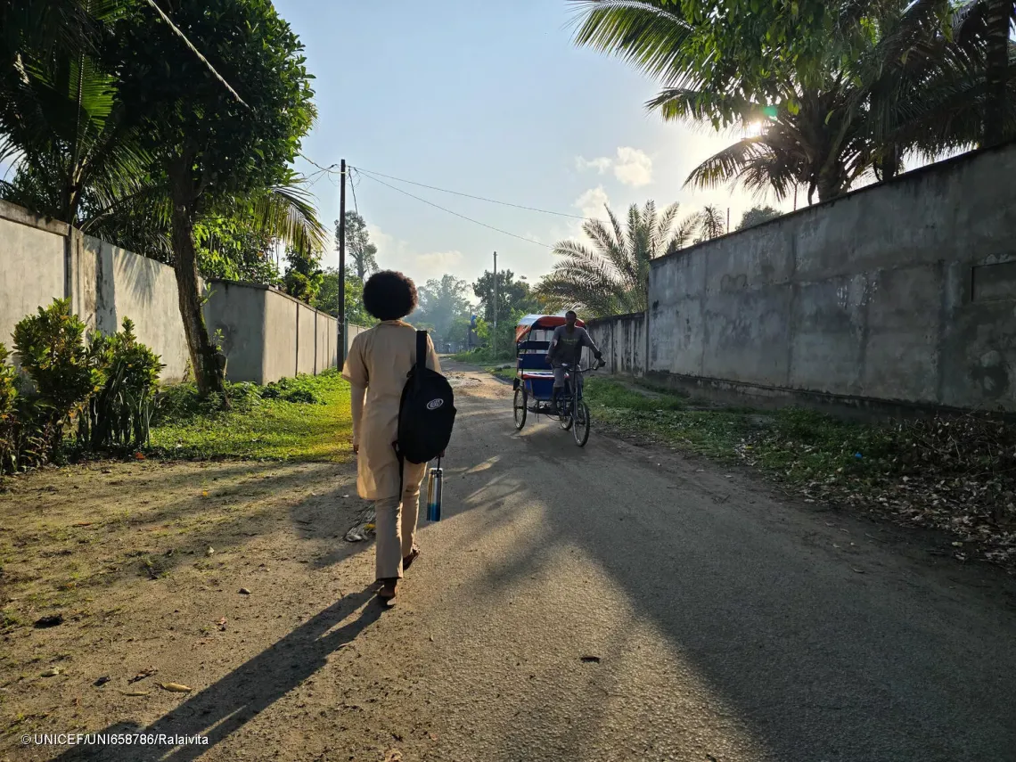  Casmira on the road to school the morning.
