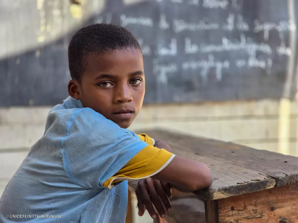 Portrait of Edvin, 13, in his classroom. 