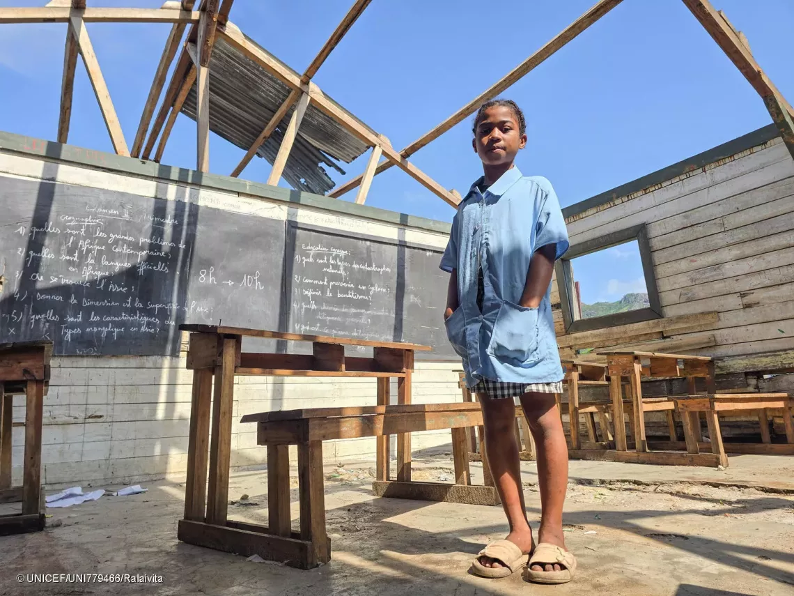 Portrait of Christianah, 11, taken in her classroom without a roof.