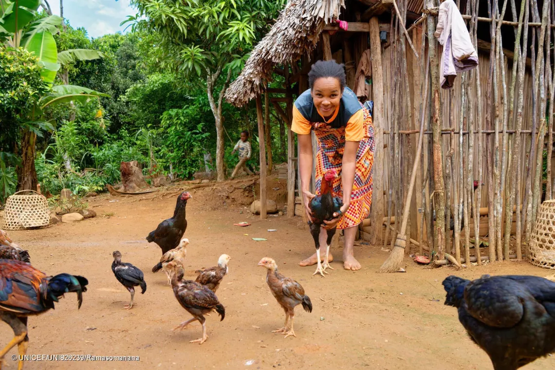 Lucie, Aim&eacute;lia's mother, looks after her chicken farm.