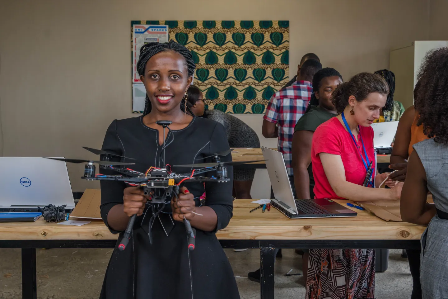 Anne with a drone under construction at the African Data and Drone Academy 