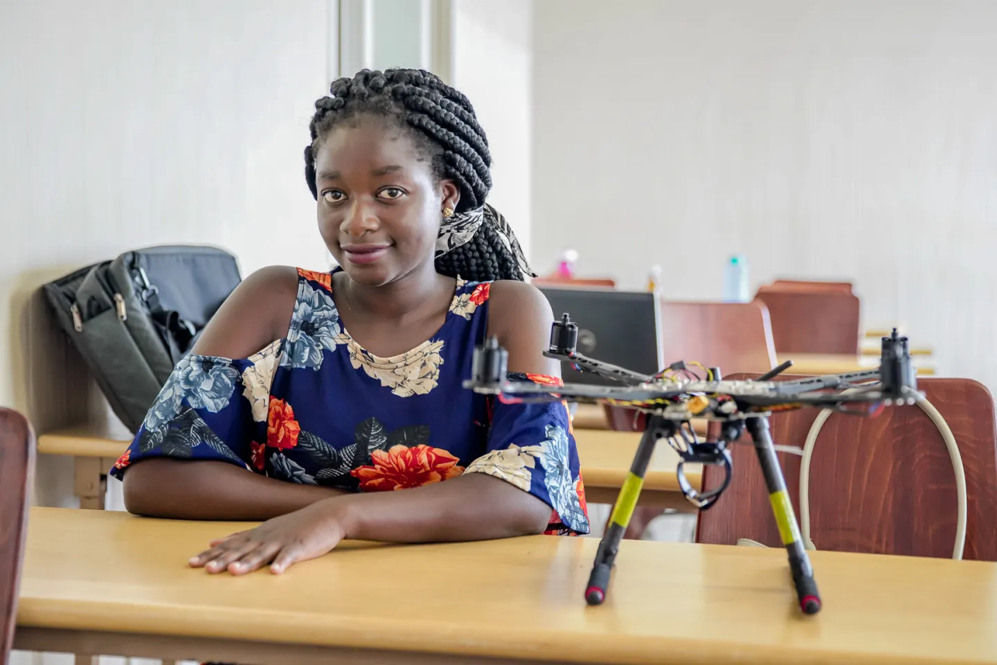 Chifuniro at the African Data and Drone Academy (ADDA) laboratory with a drone controller