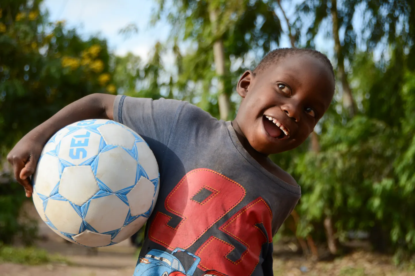 A happy child at a children's corner in Phalombe