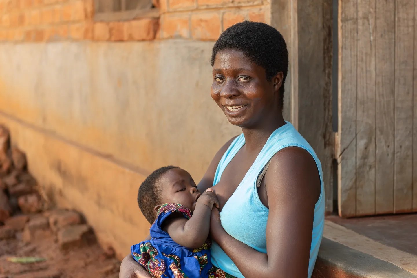 Elizabeth breastfeeding her 8 month old daughter Annette