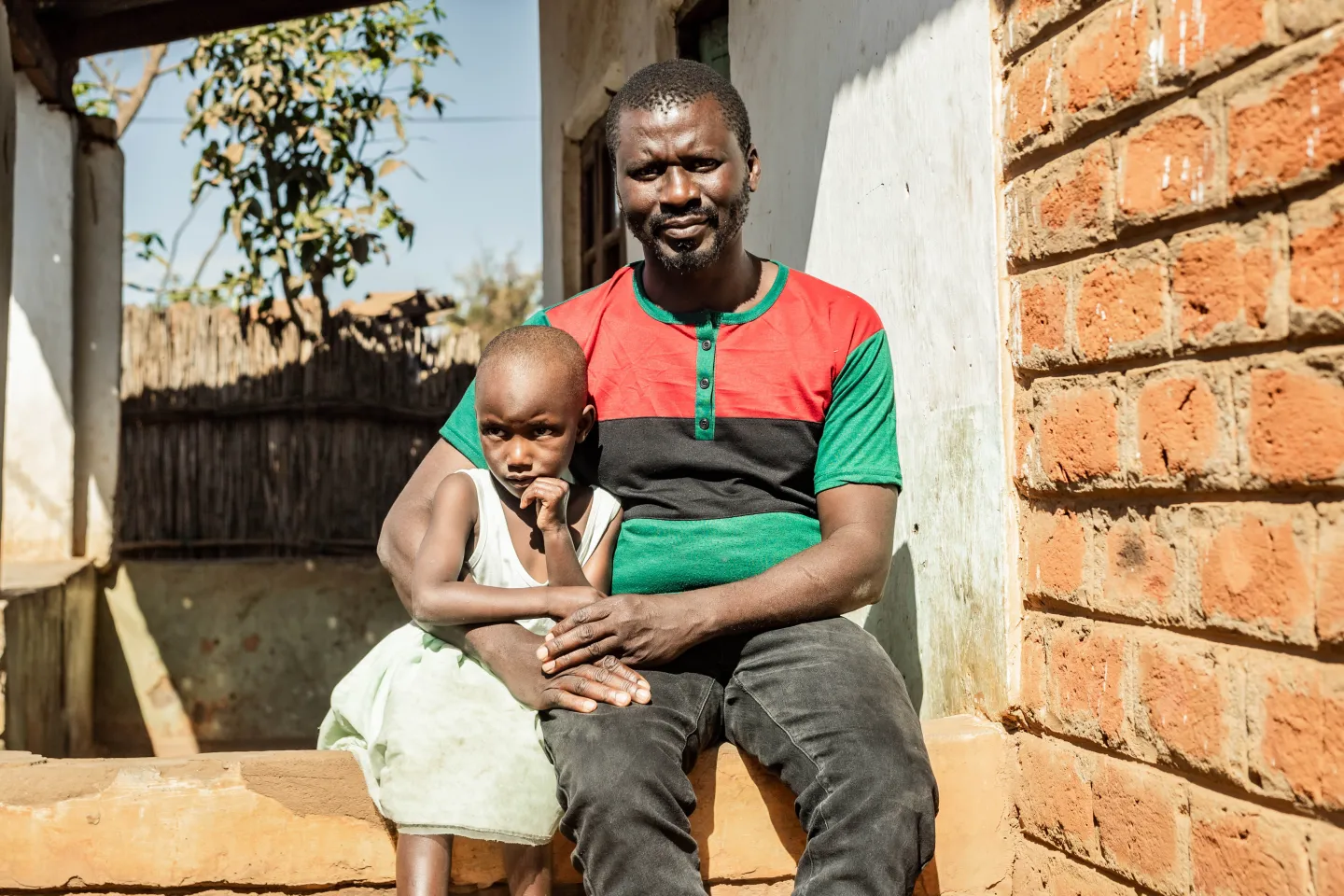 Stanley Madisi with his five year old daughter at Kasungu district hospital. 