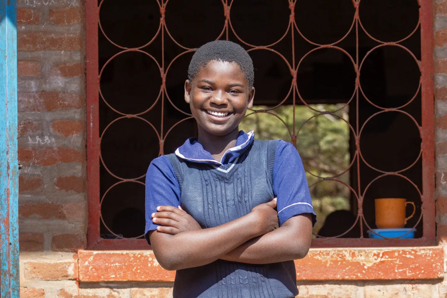 Joyce says she now enjoys learning on a desk at school.